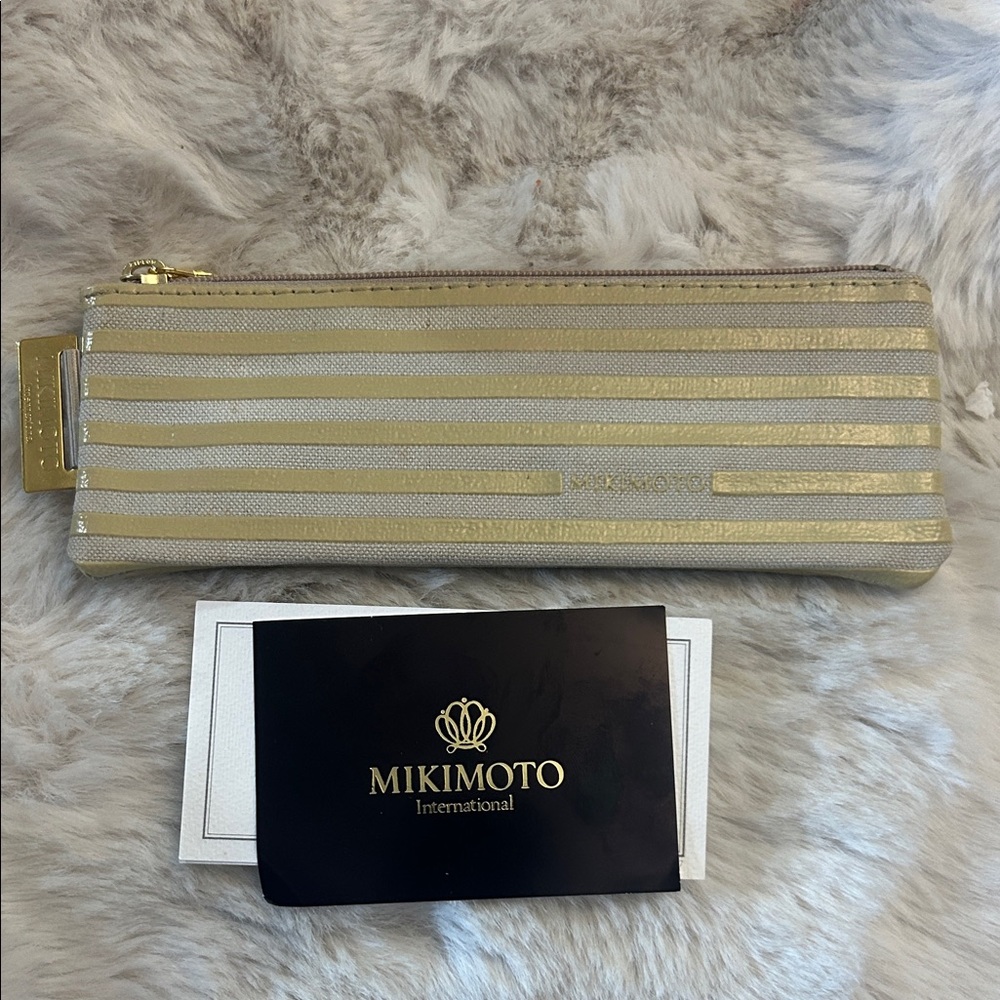 Mikimoto International striped yellow patent leather & cotton stripes pouch